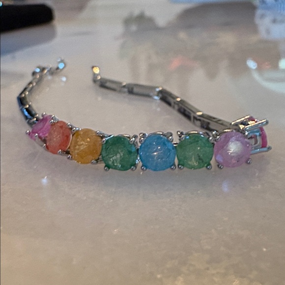 Jewelry - New Bracelet
White gold plated links multi-colored gumdrop stones 7” # G22